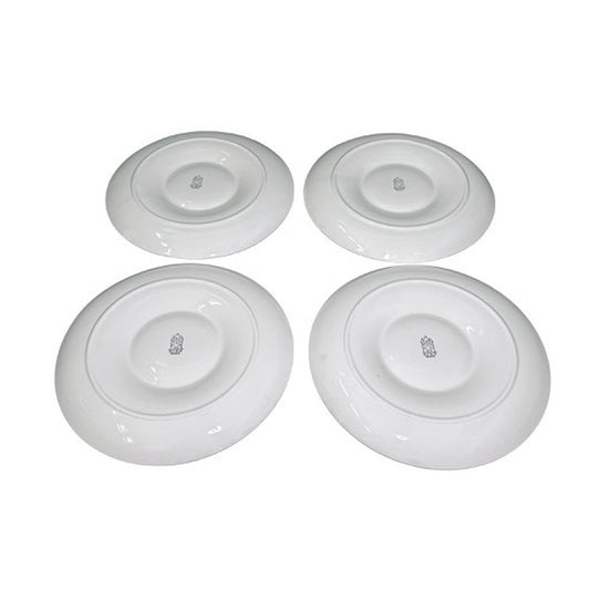 Underside angled views of four Gien France artichoke plates with maker marks