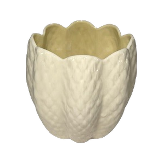 Vintage Belleek Limpet yellow porcelain planter, angled view on transparent background