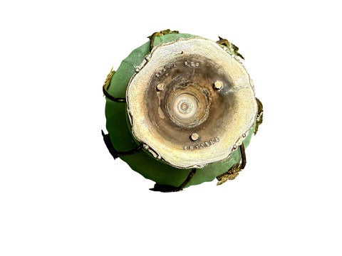 Underside of vintage Brama bowl showing footed metal base and maker mark