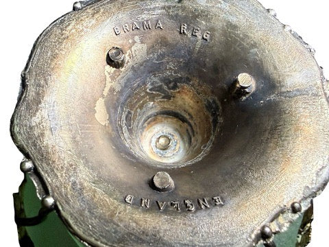 Close-up of Brama Reg England mark on silver-tone base