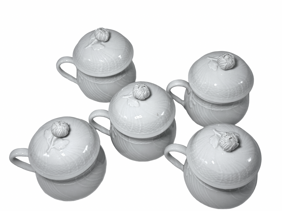 Overhead view of five Richard Ginori covered cups