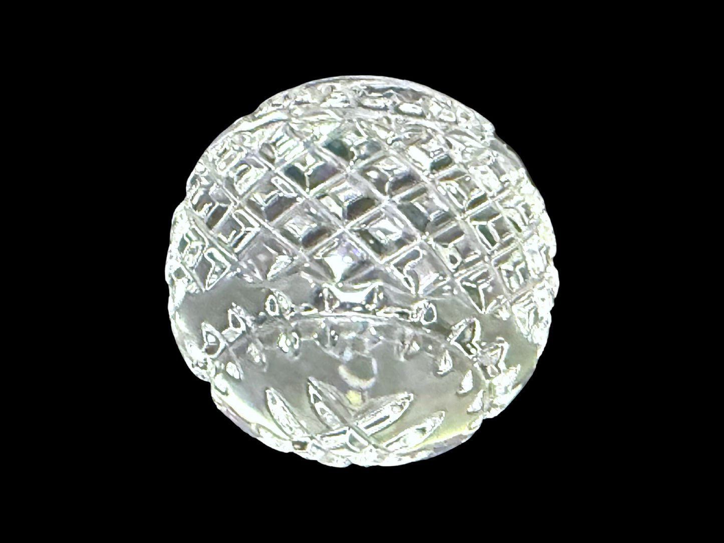 Waterford crystal round paperweight, side profile on black background